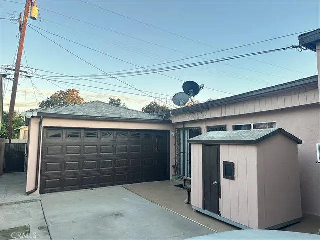 a backyard of a house with outdoor seating