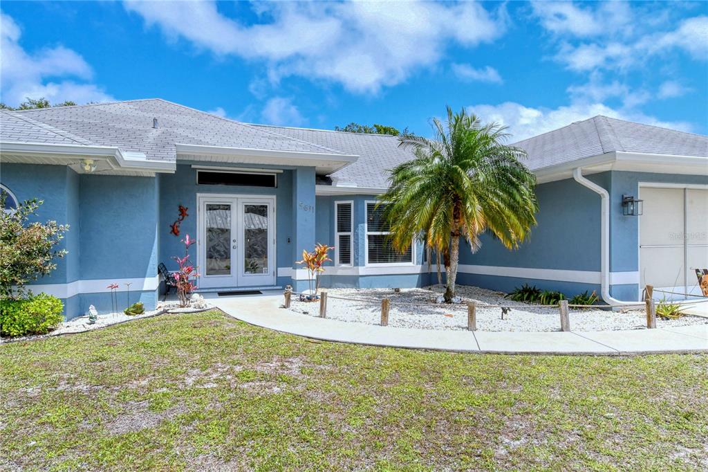 5611 Baylor Road Venice, FL 34293 - Photo 1 of 1 a swimming pool with outdoor seating yard and patio