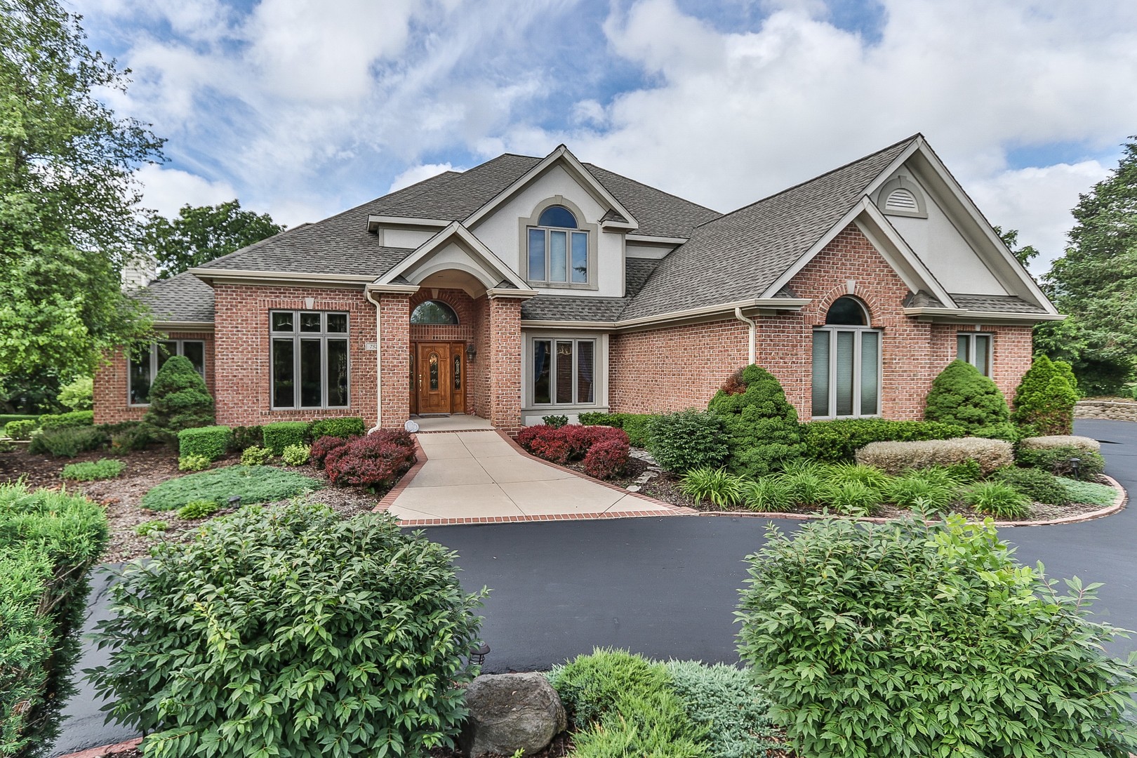 front view of a house with a yard