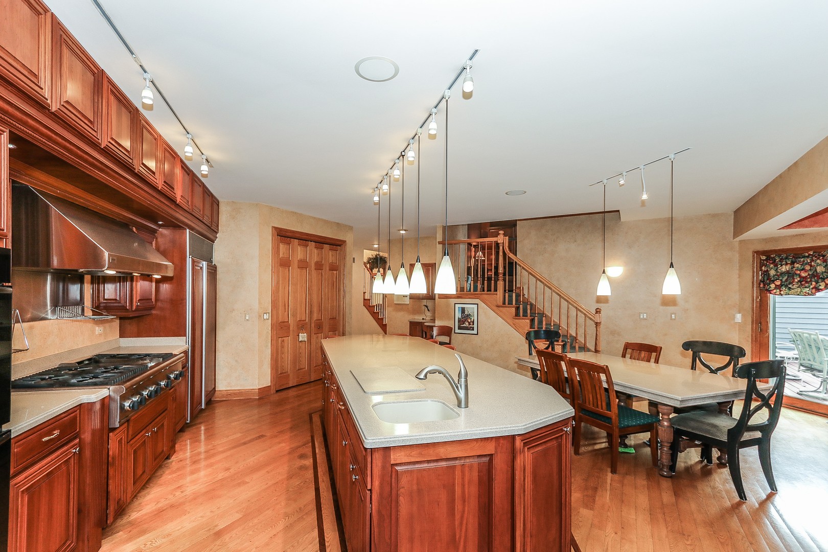 752 Saddle Ridge Crystal Lake, IL 60012 - Photo 11 of 49 a large kitchen with a table and chairs