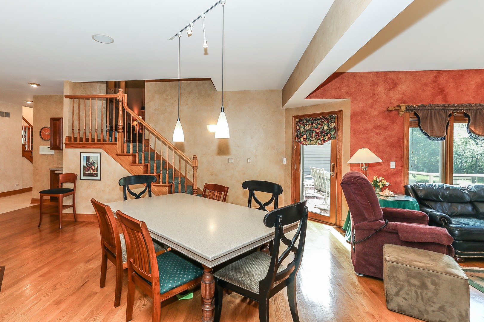 752 Saddle Ridge Crystal Lake, IL 60012 - Photo 12 of 49 a dining room with furniture and wooden floor