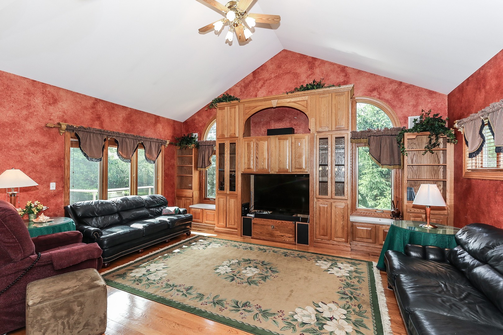 752 Saddle Ridge Crystal Lake, IL 60012 - Photo 13 of 49 a living room with furniture a flat screen tv and a fireplace