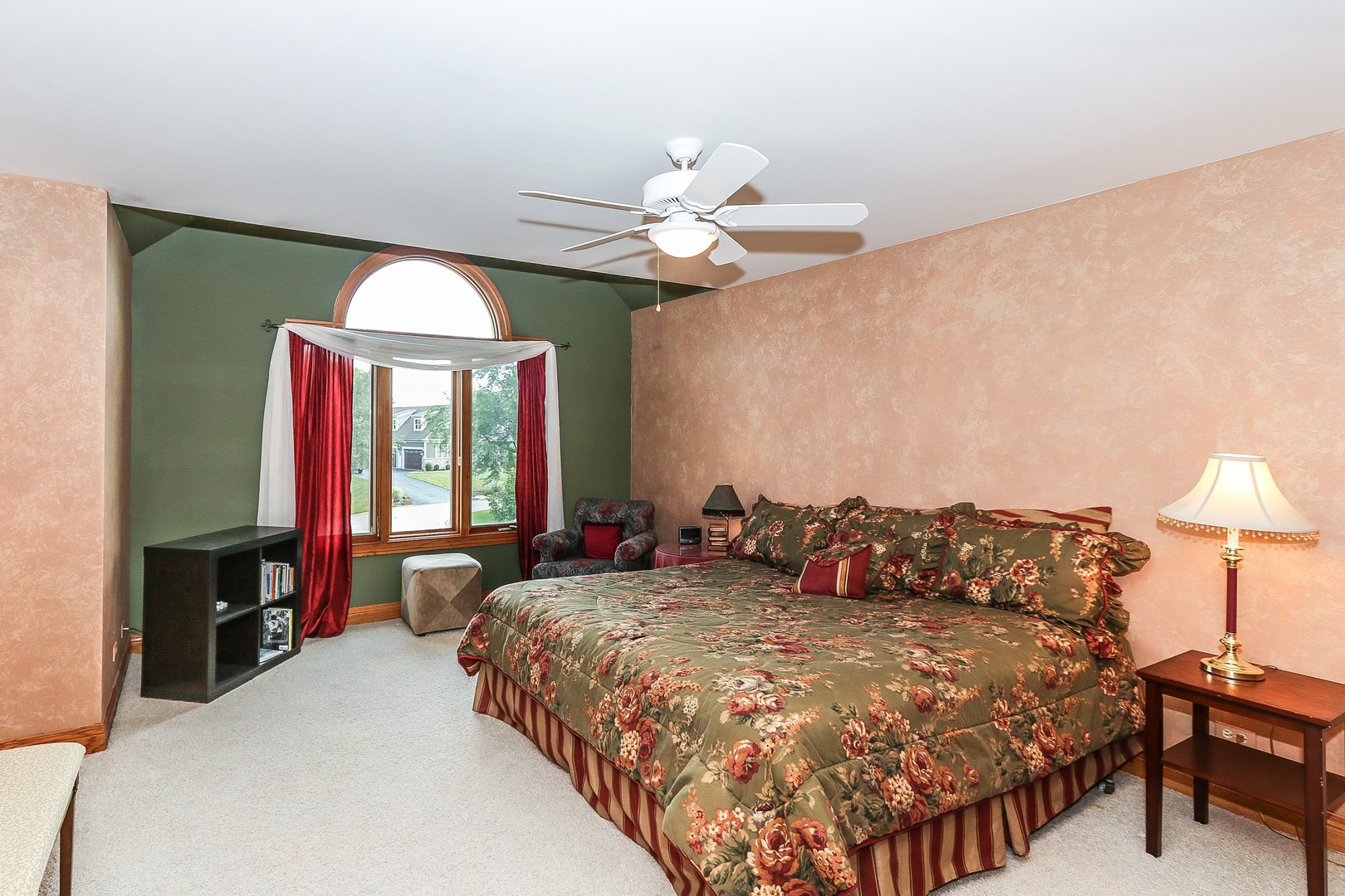 752 Saddle Ridge Crystal Lake, IL 60012 - Photo 28 of 49 a bedroom with a large bed and a chandelier