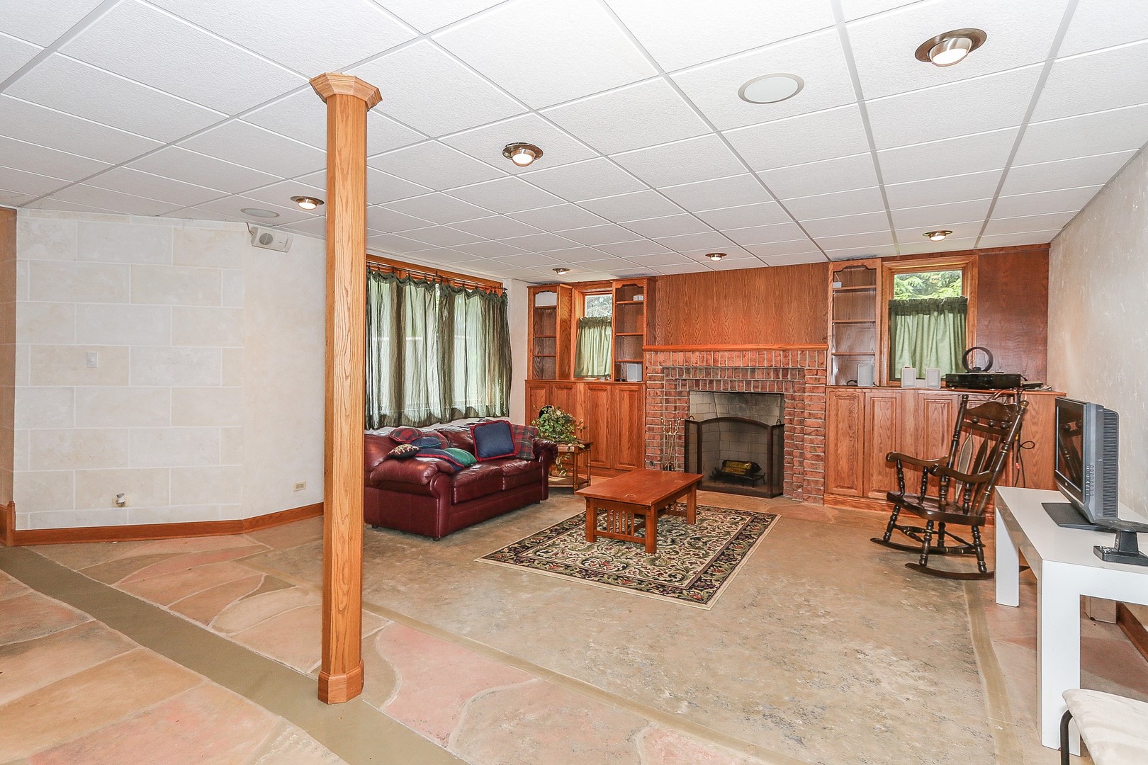 752 Saddle Ridge Crystal Lake, IL 60012 - Photo 39 of 49 a living room with furniture a fireplace and a flat screen tv