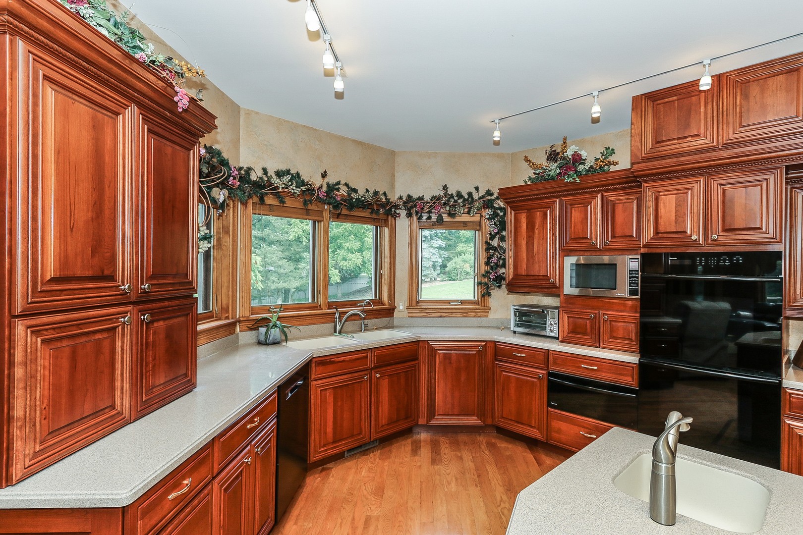 752 Saddle Ridge Crystal Lake, IL 60012 - Photo 8 of 49 a kitchen with stainless steel appliances granite countertop a sink and wooden cabinets