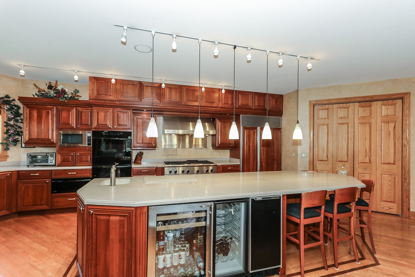 752 Saddle Ridge Crystal Lake, IL 60012 - Photo 9 of 49 a kitchen with stainless steel appliances granite countertop a stove a sink and a refrigerator