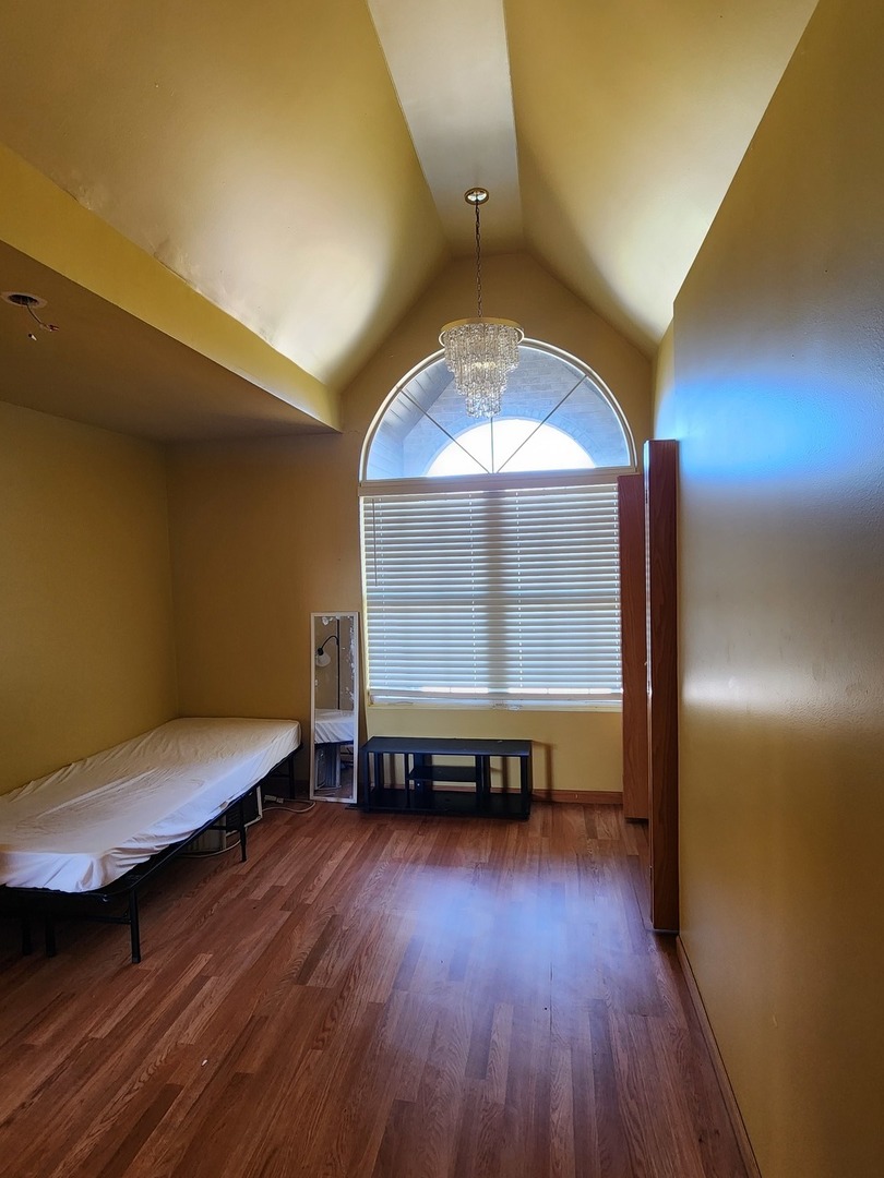 15400 Crocket Lane Markham, IL 60428 - Photo 14 of 19 a view of a room with wooden floor table and windows
