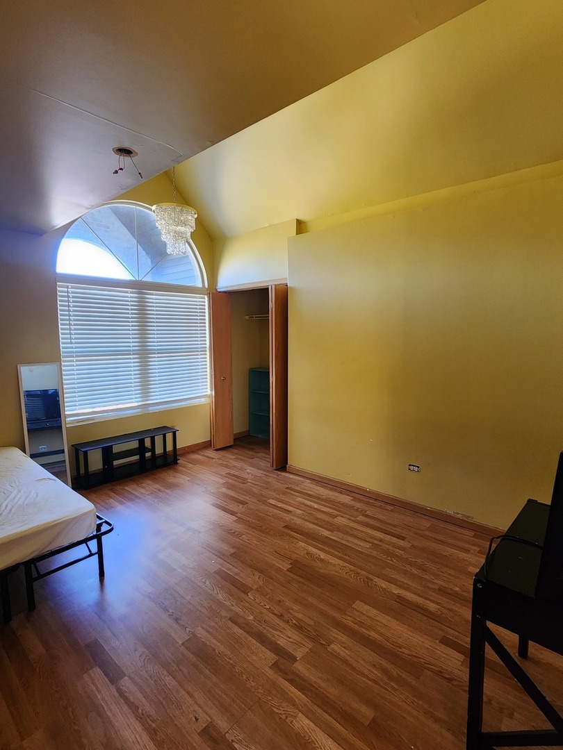 15400 Crocket Lane Markham, IL 60428 - Photo 15 of 19 a view of room with window and wooden floor