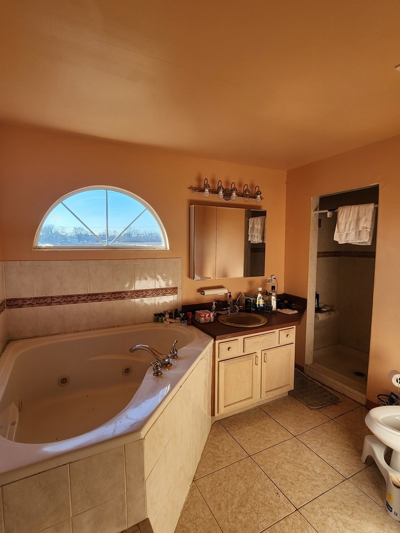 15400 Crocket Lane Markham, IL 60428 - Photo 17 of 19 a kitchen with stainless steel appliances granite countertop a sink and cabinets