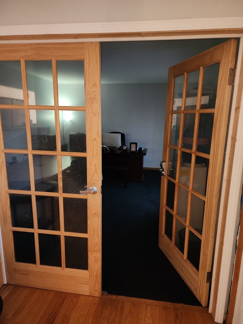15400 Crocket Lane Markham, IL 60428 - Photo 4 of 19 a view of an empty room with wooden floor and a window