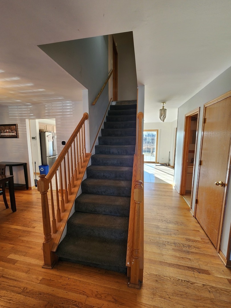 15400 Crocket Lane Markham, IL 60428 - Photo 7 of 19 a view of entryway and hall with wooden floor