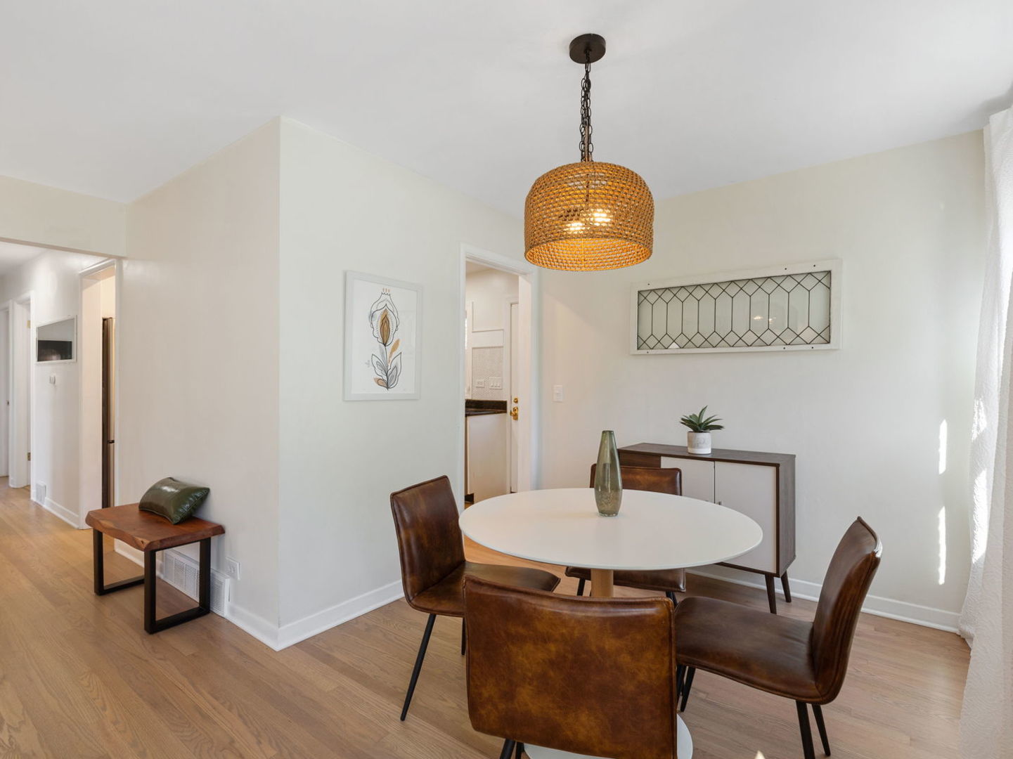 578 Sumac Road Highland Park, IL 60035 - Photo 11 of 28 a view of a dining room with furniture wooden floor and a chandelier