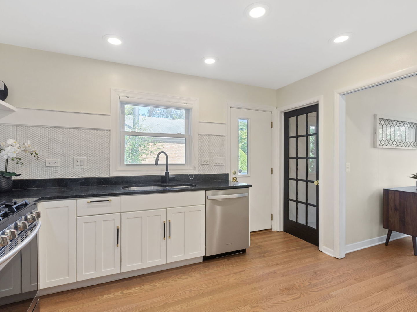 578 Sumac Road Highland Park, IL 60035 - Photo 3 of 28 a kitchen with granite countertop a sink and a stove top oven