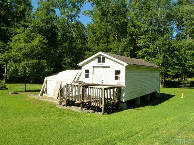 212 Mace Road Mebane, NC 27302 - Photo 22 of 23 This large workshop could be a pottery studio, artist studio, wood working shop.....OR??????