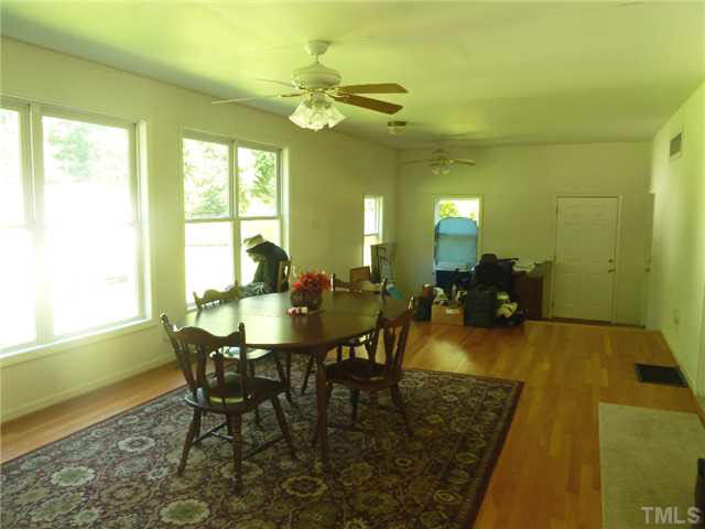 212 Mace Road Mebane, NC 27302 - Photo 9 of 23 Another view of the large sun room. Door leads out to small deck and backyard.