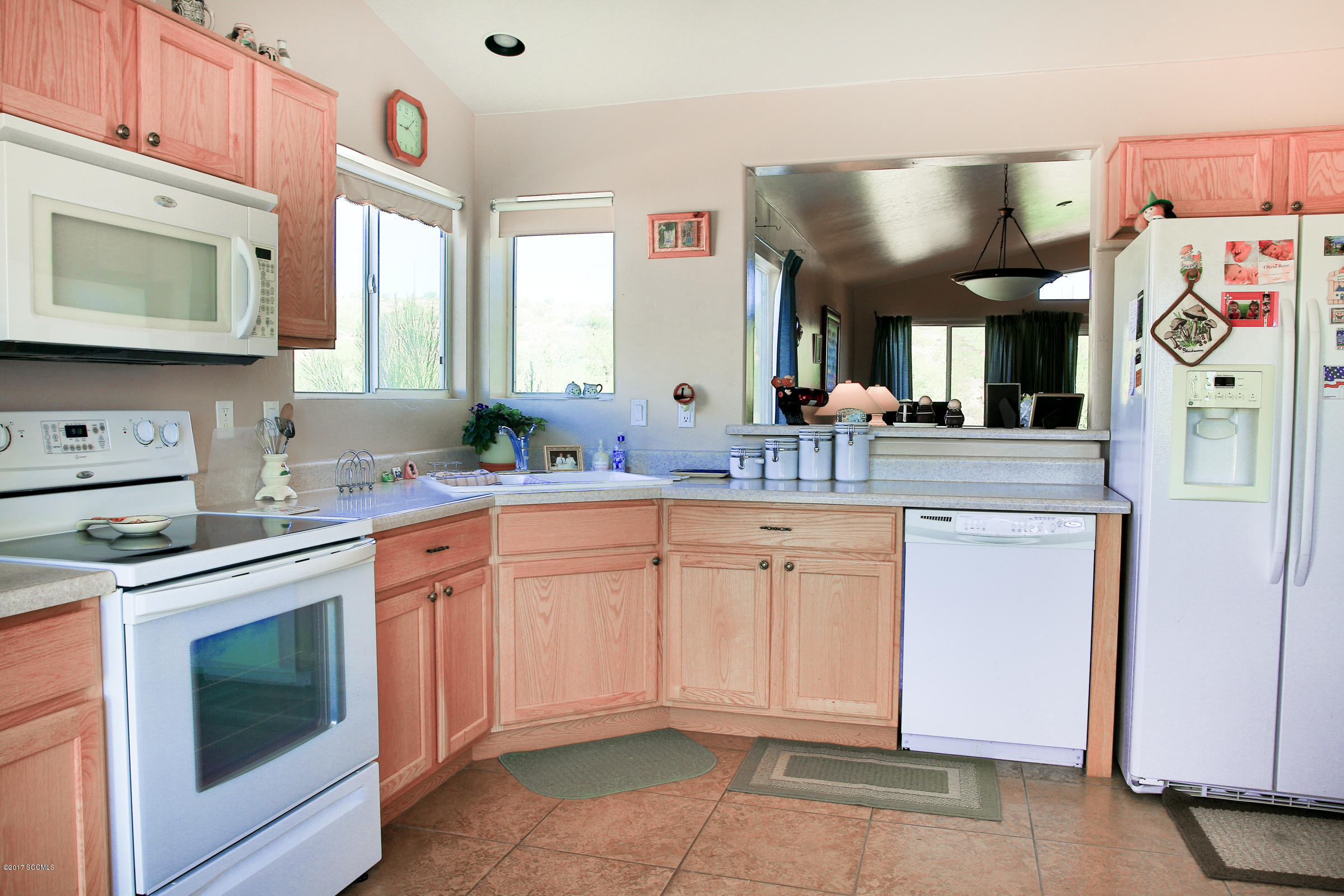 162 Utah Court Rio Rico, AZ 85648 - Photo 3 of 21 a kitchen with granite countertop cabinets stainless steel appliances and a sink