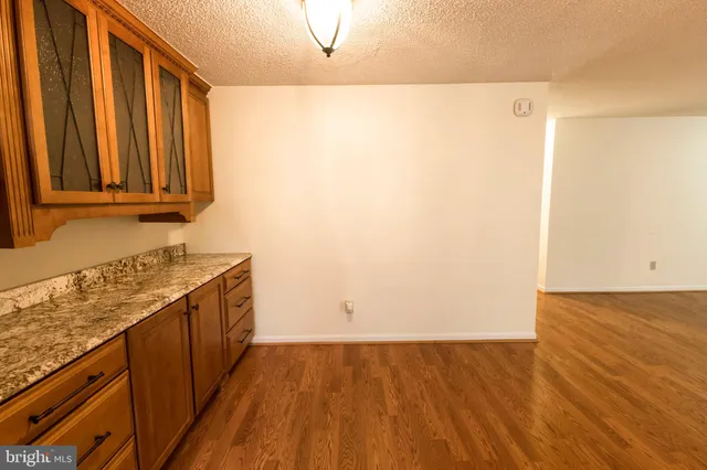 a view of a kitchen with wooden floor