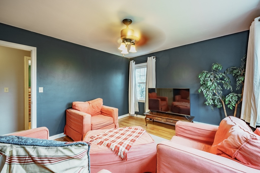 384 Forest Hills Road Springfield, MA 01128 - Photo 15 of 36 a living room with furniture fireplace and a potted plant