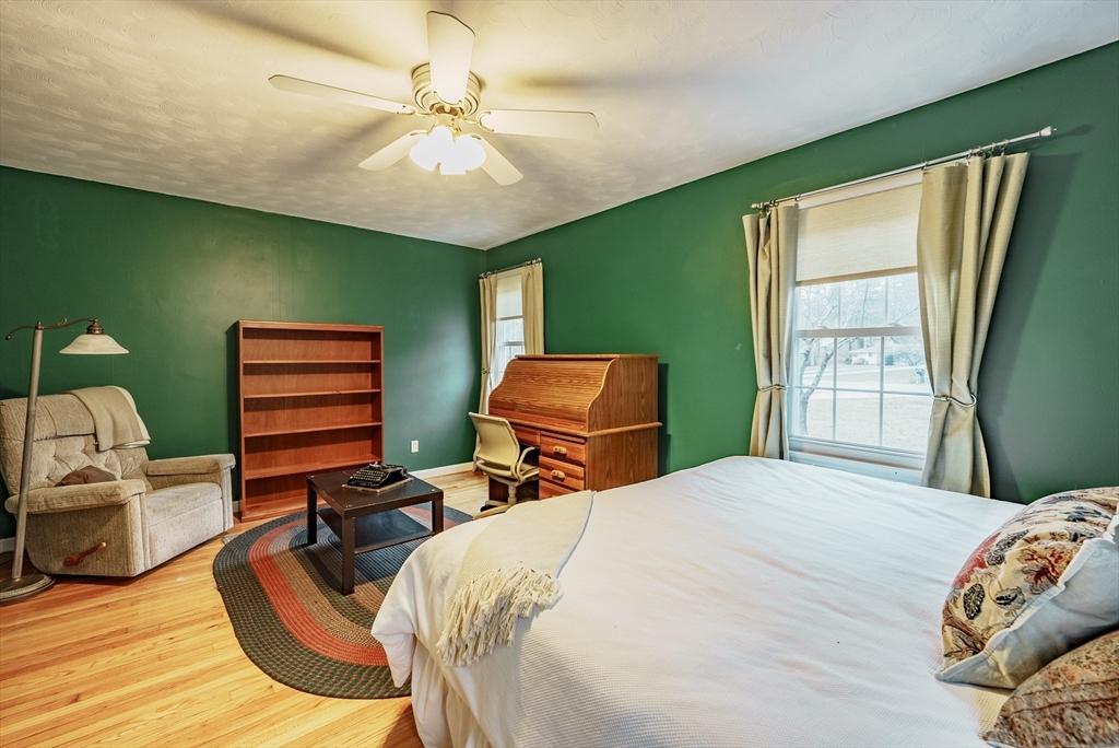 384 Forest Hills Road Springfield, MA 01128 - Photo 16 of 36 a bedroom with a bed and a chair