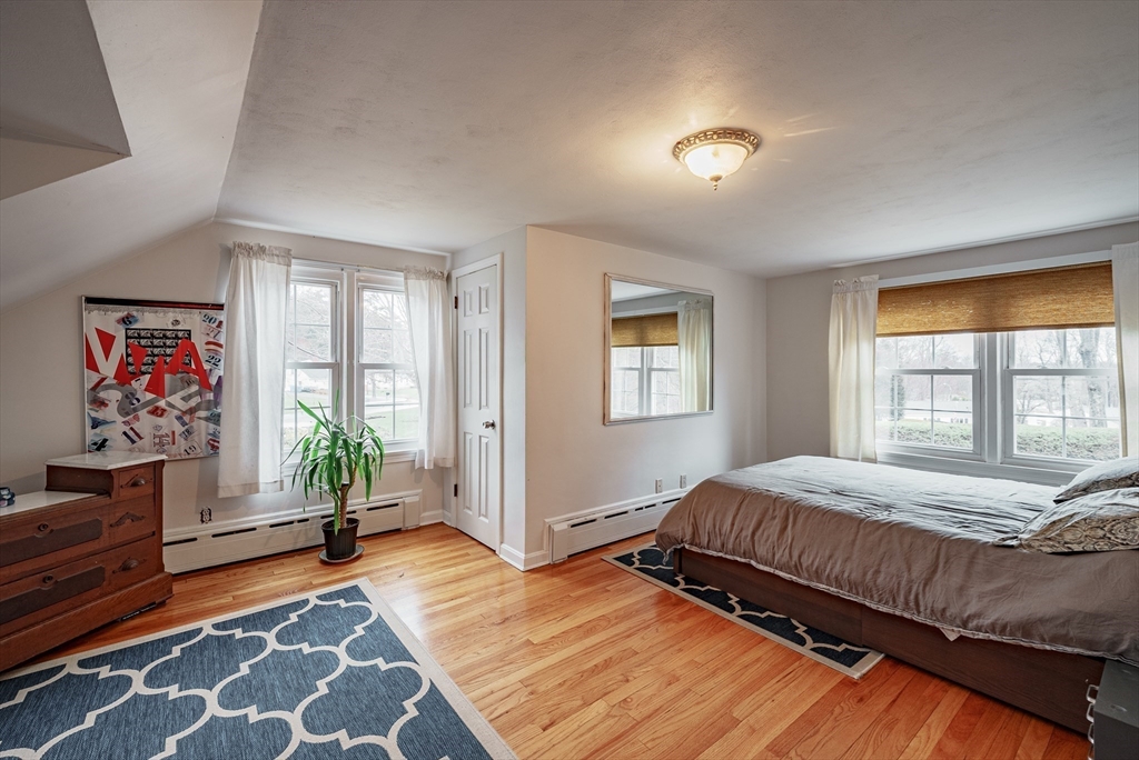 384 Forest Hills Road Springfield, MA 01128 - Photo 20 of 36 a bedroom with a bed and a couch