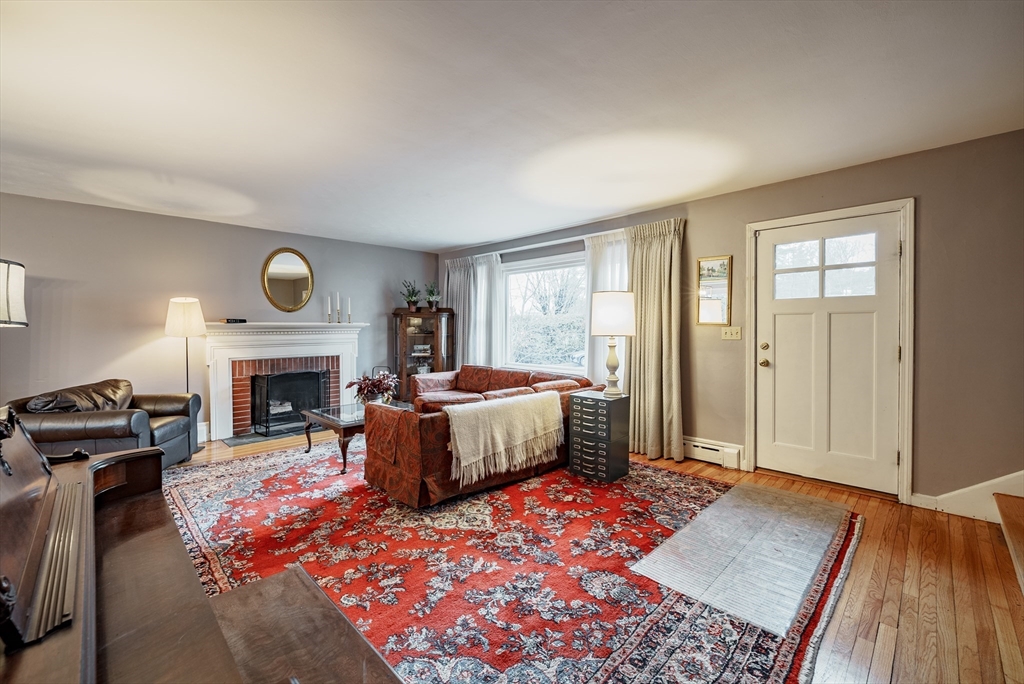 384 Forest Hills Road Springfield, MA 01128 - Photo 3 of 36 a living room with furniture and a fireplace