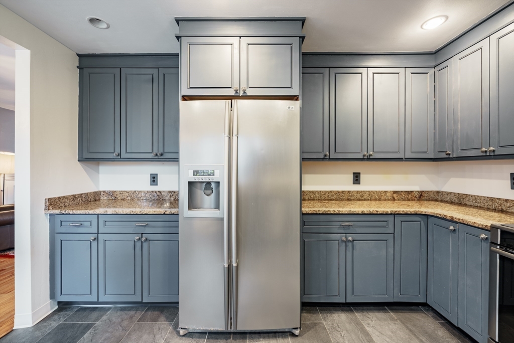 384 Forest Hills Road Springfield, MA 01128 - Photo 9 of 36 a kitchen with stainless steel appliances granite countertop a refrigerator and a sink
