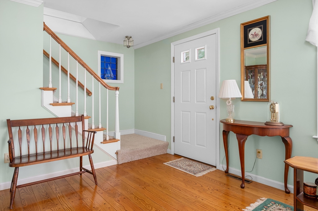 200 Sturbridge Drive Barnstable, MA 02655 - Photo 16 of 39 a view of an entryway with wooden floor and staircase