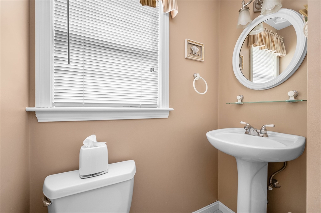 200 Sturbridge Drive Barnstable, MA 02655 - Photo 17 of 39 a bathroom with a toilet sink and mirror