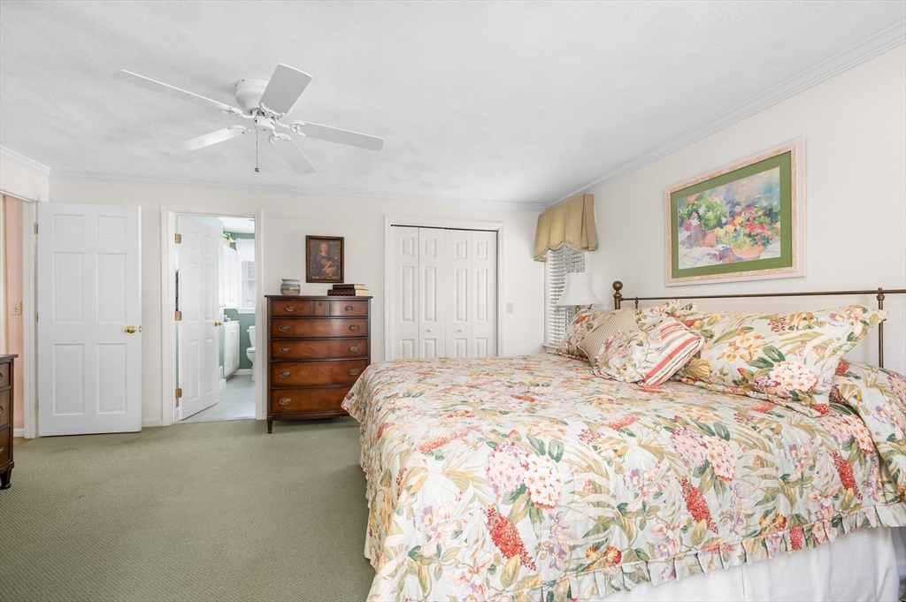 200 Sturbridge Drive Barnstable, MA 02655 - Photo 19 of 39 a bed room with a bed and a painting