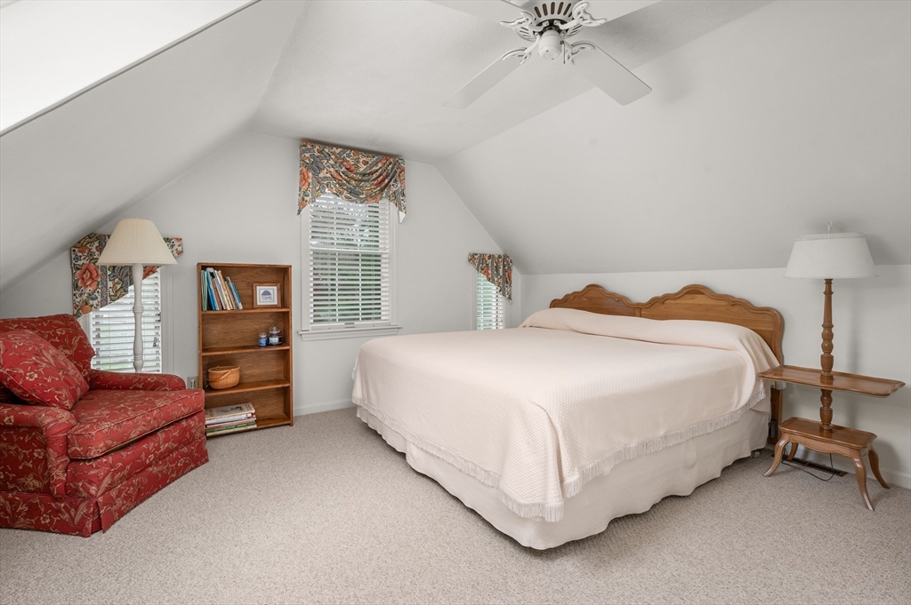 200 Sturbridge Drive Barnstable, MA 02655 - Photo 22 of 39 a spacious bedroom with a bed and a couch