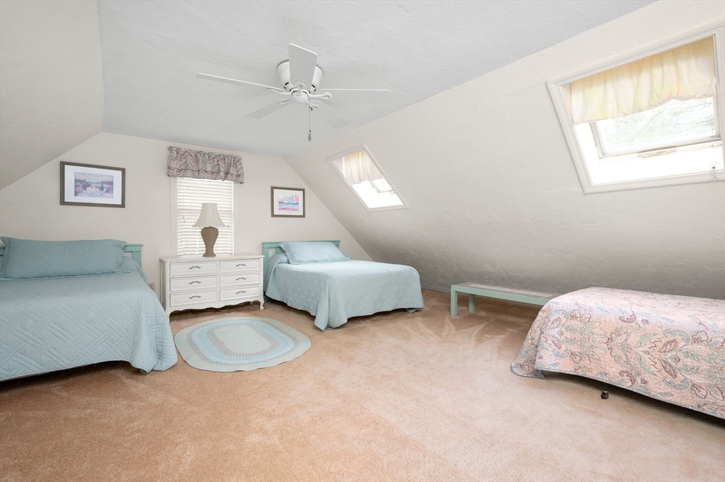 200 Sturbridge Drive Barnstable, MA 02655 - Photo 27 of 39 a spacious bedroom with a bed and a window