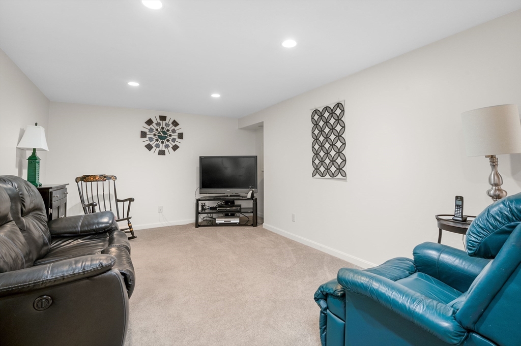 200 Sturbridge Drive Barnstable, MA 02655 - Photo 29 of 39 a living room with furniture and a flat screen tv
