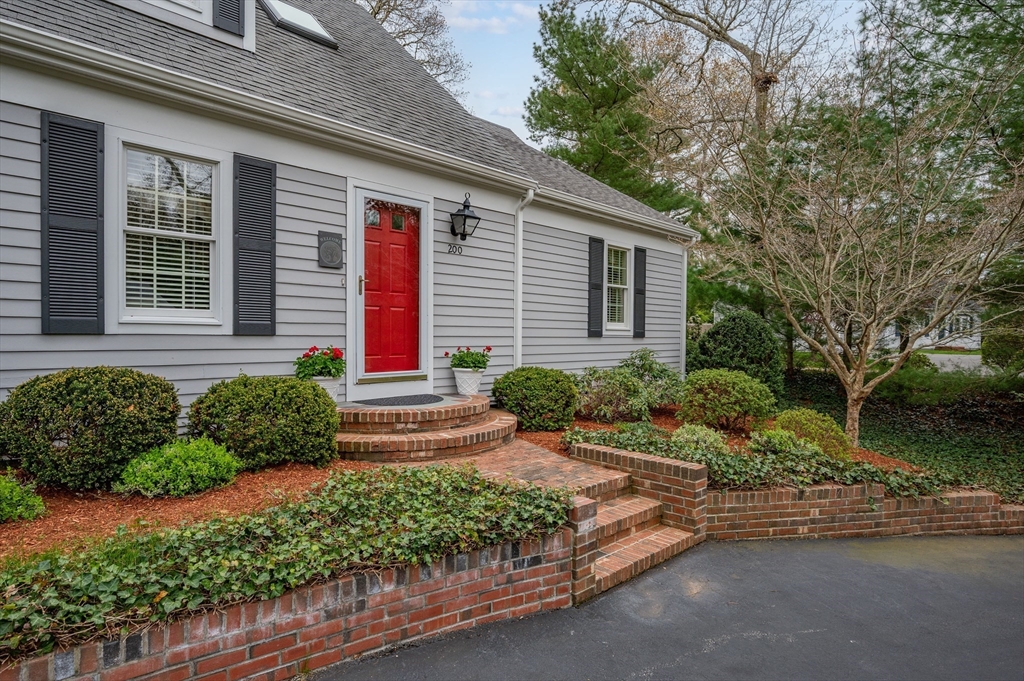 200 Sturbridge Drive Barnstable, MA 02655 - Photo 32 of 39 a front view of a house with a yard and outdoor seating