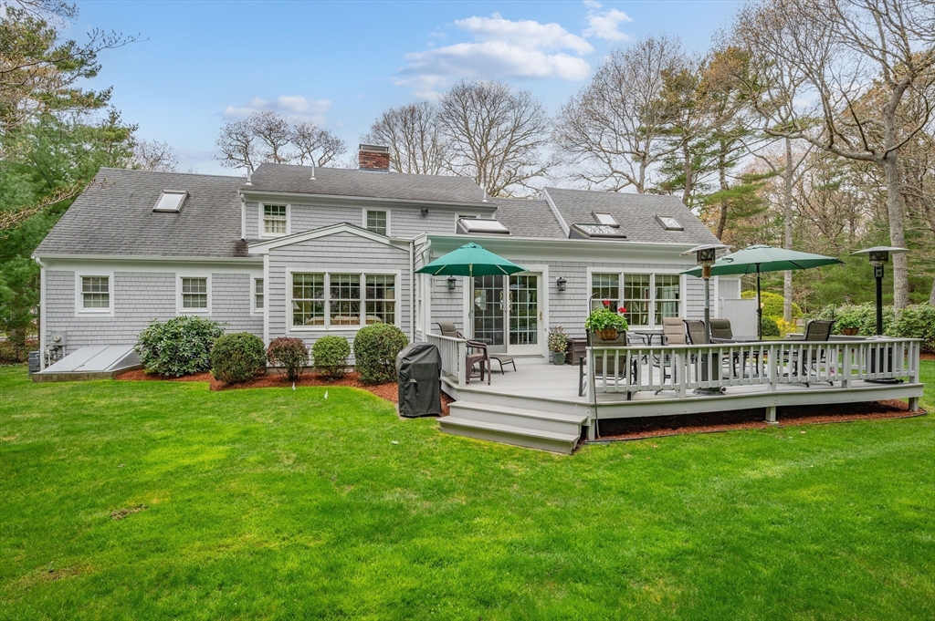 200 Sturbridge Drive Barnstable, MA 02655 - Photo 38 of 39 a view of a house with a backyard and a garden