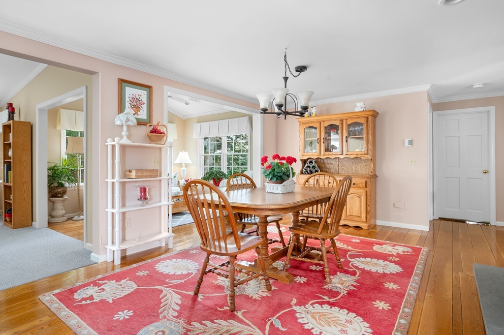200 Sturbridge Drive Barnstable, MA 02655 - Photo 7 of 39 a view of a dining room with furniture and wooden floor