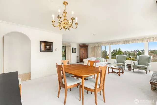 a view of a dining room with furniture window and outside view