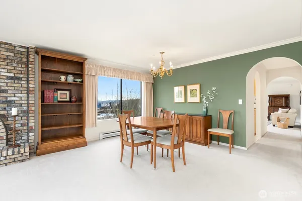 a dining room with furniture and chandelier