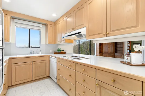 a kitchen with sink cabinets and window
