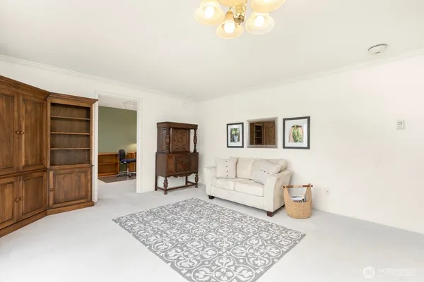 a living room with furniture and a rug