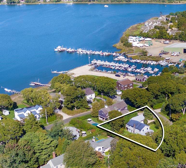 21 Cove Road Sag Harbor, NY 11963 - Photo 1 of 37 Aerial view of property's location featuring a nearby body of water and property parcel outlined