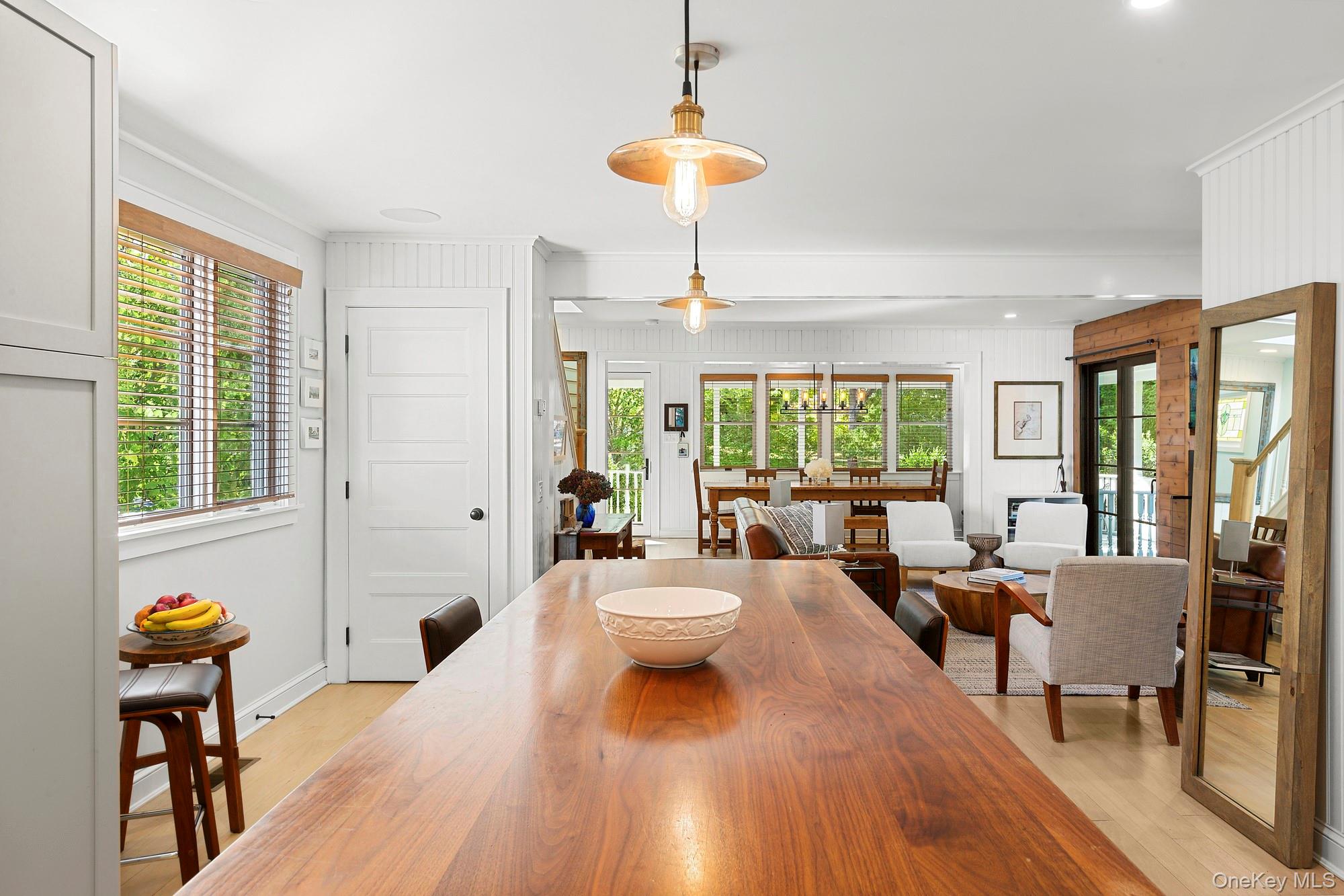 21 Cove Road Sag Harbor, NY 11963 - Photo 15 of 37 Dining room featuring light wood-style flooring and baseboards