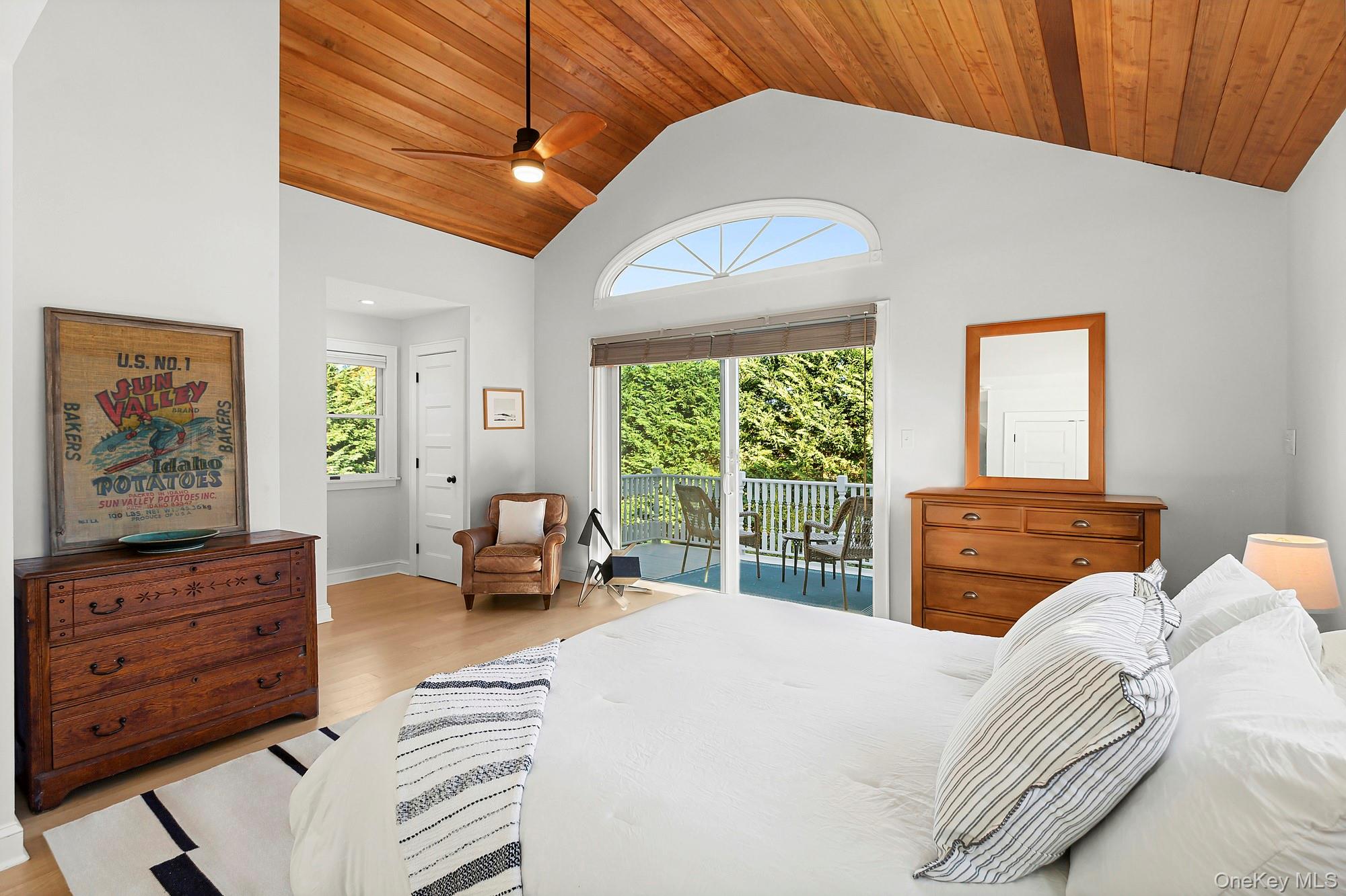 21 Cove Road Sag Harbor, NY 11963 - Photo 24 of 37 Bedroom featuring wood ceiling, access to exterior, ceiling fan, light wood-type flooring, and high vaulted ceiling