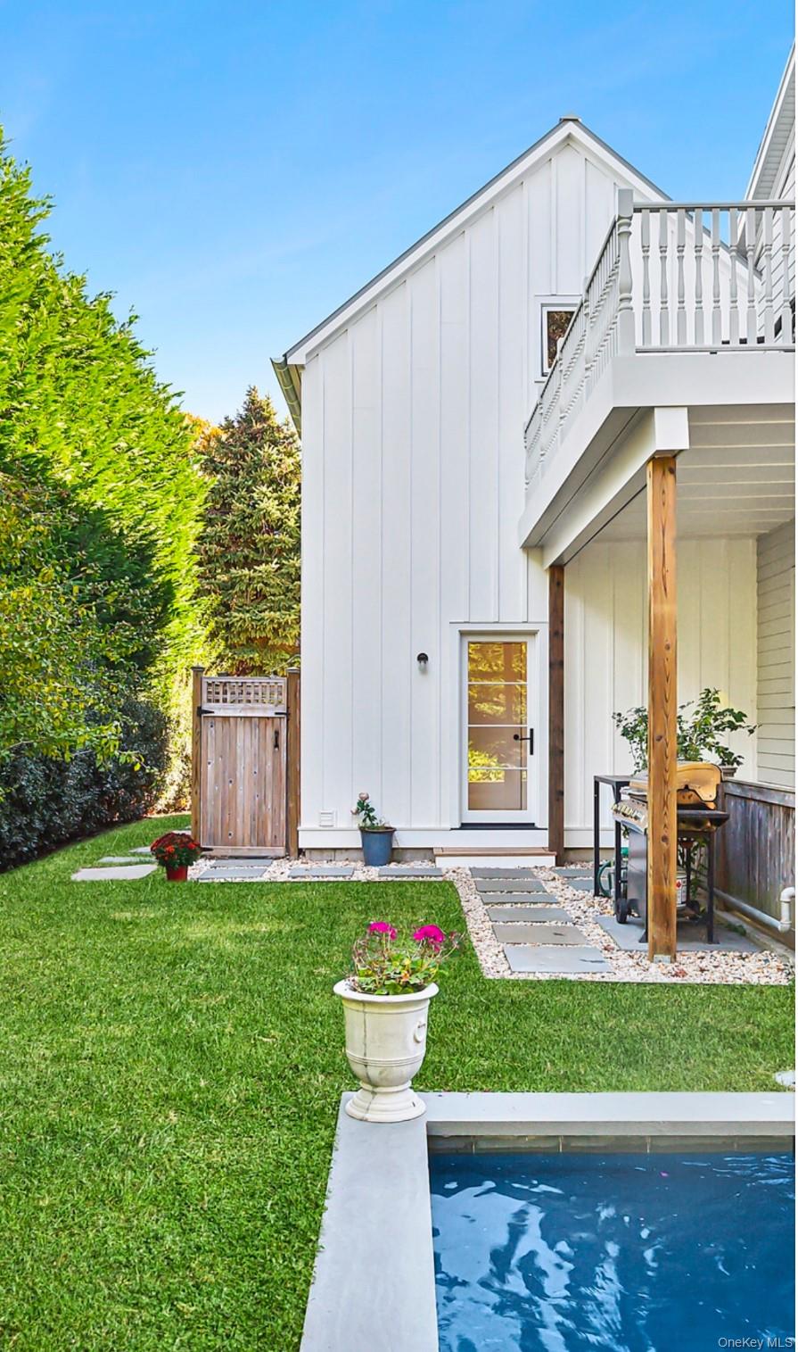 21 Cove Road Sag Harbor, NY 11963 - Photo 34 of 37 Back of property featuring board and batten siding