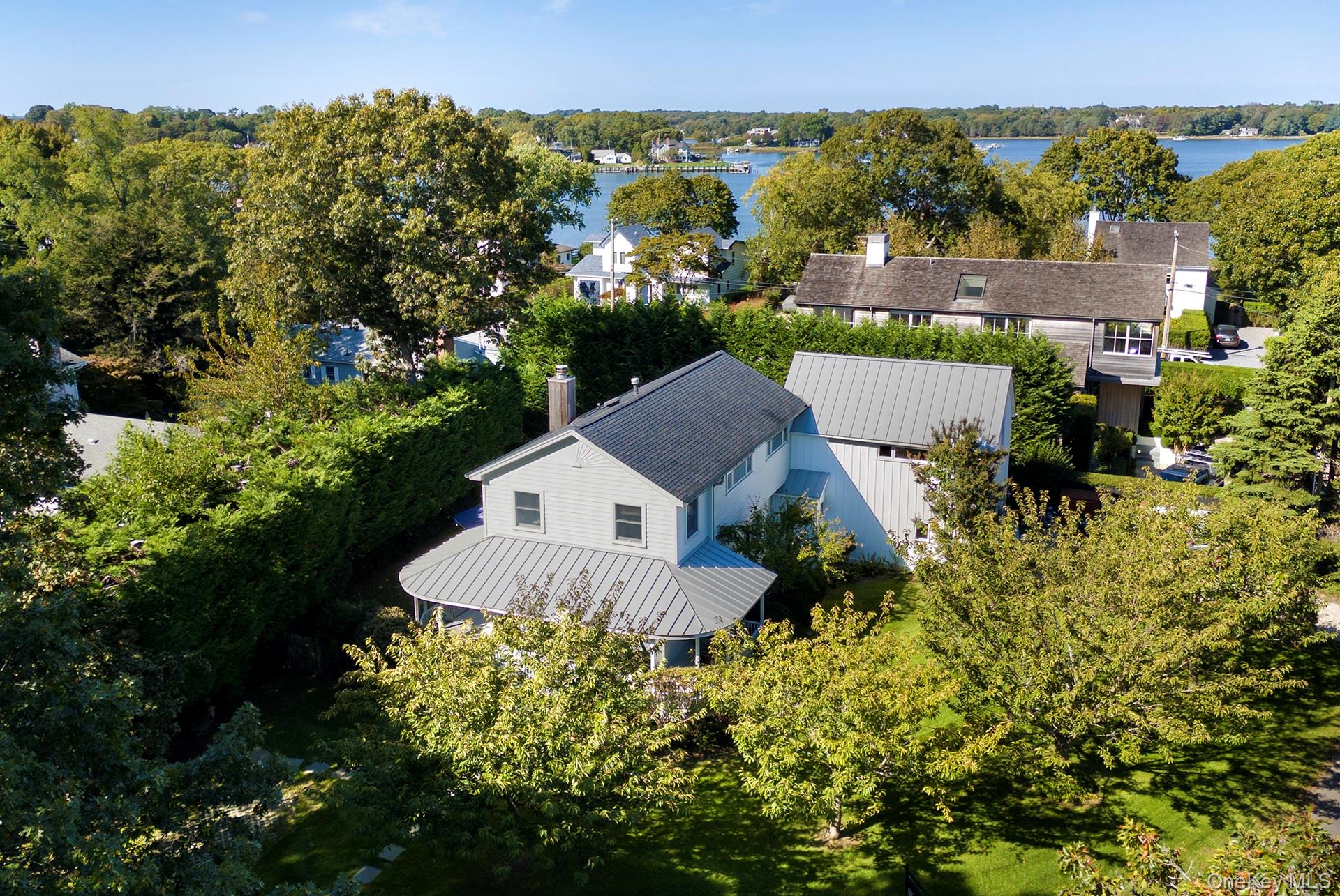 21 Cove Road Sag Harbor, NY 11963 - Photo 6 of 37 Aerial view of property and surrounding area featuring a tree filled landscape and a large body of water
