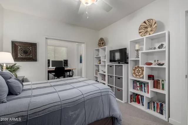 a view of a livingroom with furniture and a flat screen tv