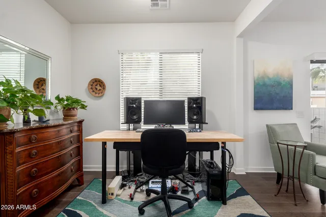 a work room with furniture and a window
