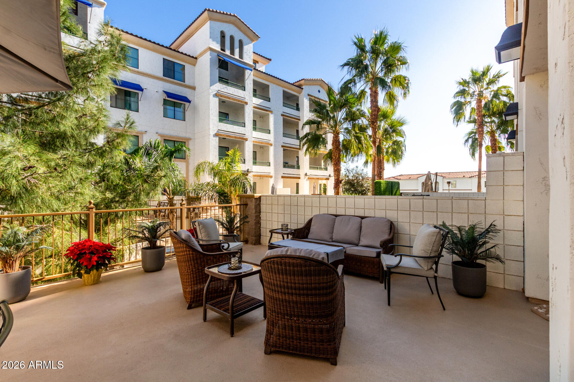 2511 West Queen Creek Road, Unit 124 Chandler, AZ 85248 - Photo 21 of 39 a view of a patio with couches table and chairs and potted plants