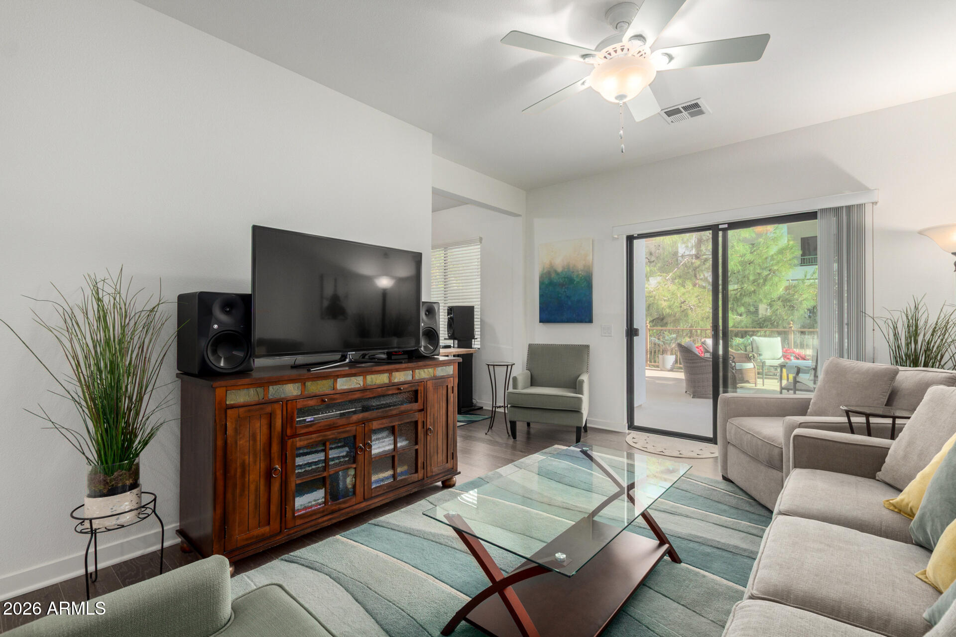 2511 West Queen Creek Road, Unit 124 Chandler, AZ 85248 - Photo 30 of 39 a living room with furniture and a flat screen tv