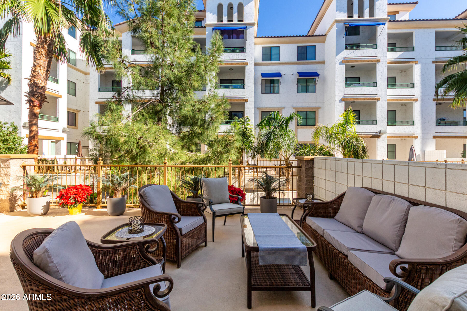 2511 West Queen Creek Road, Unit 124 Chandler, AZ 85248 - Photo 3 of 39 a view of a patio with couches table and chairs and potted plants