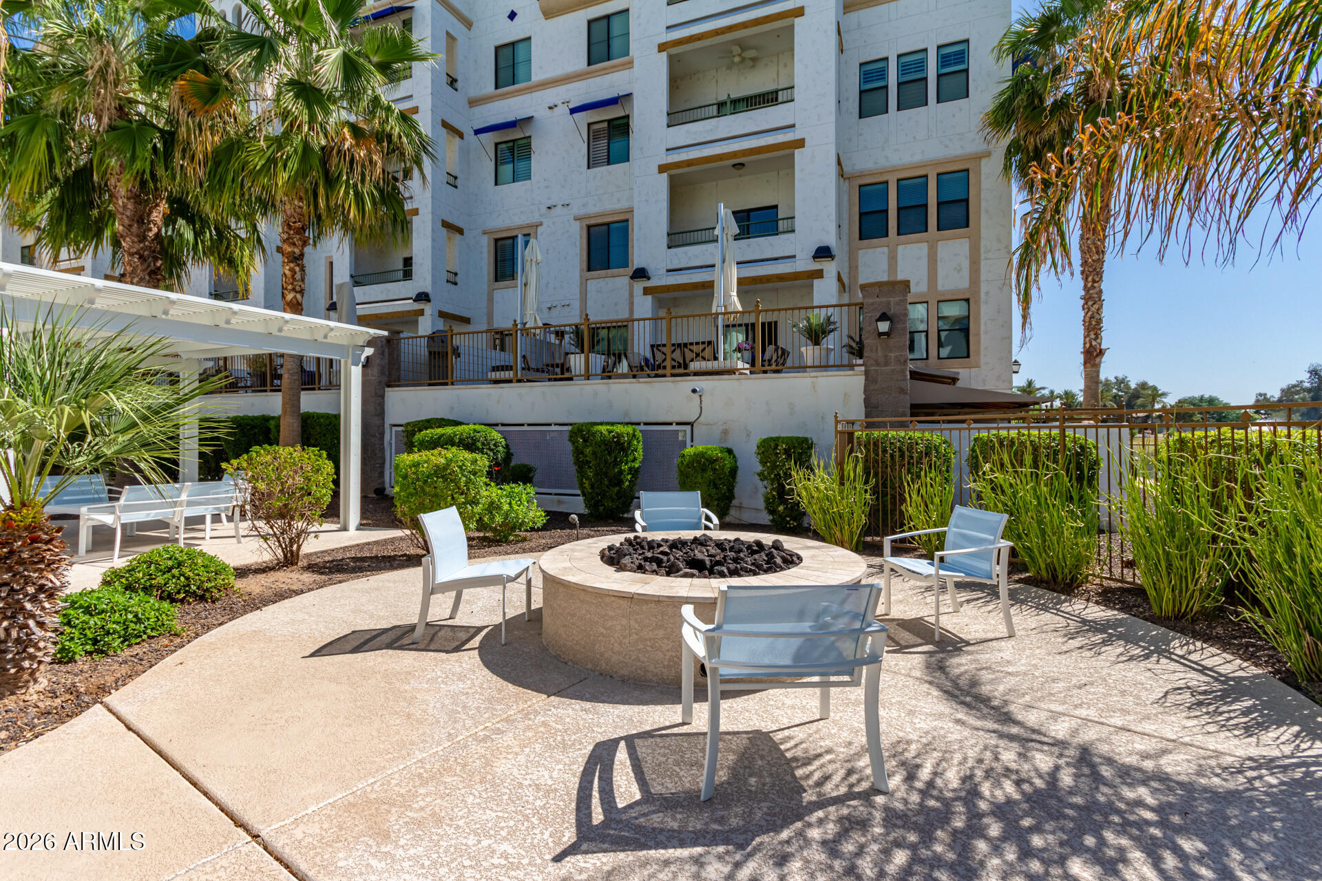 2511 West Queen Creek Road, Unit 124 Chandler, AZ 85248 - Photo 32 of 39 a view of a patio with table and chairs and potted plants